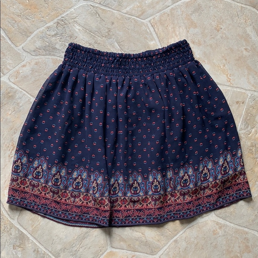 Navy blue skirt, floral design, size XS. New!